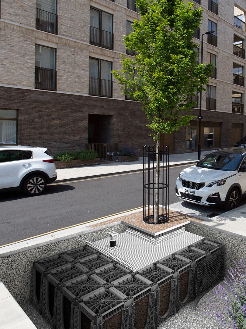 Rendering showing a cutaway with an urban tree and RootSpace soil cells providing soil beneath the pavement, and root barriers which prevent pavement damage caused by root heave